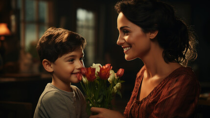 Son with a bouquet of flowers congratulates mom on her birthday and mother's day