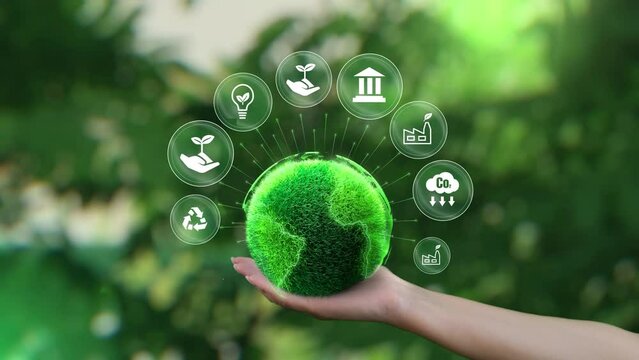 Ecology icon concept. ESG environment, society and governance. Saving the green planet in the hands of humans on green background.