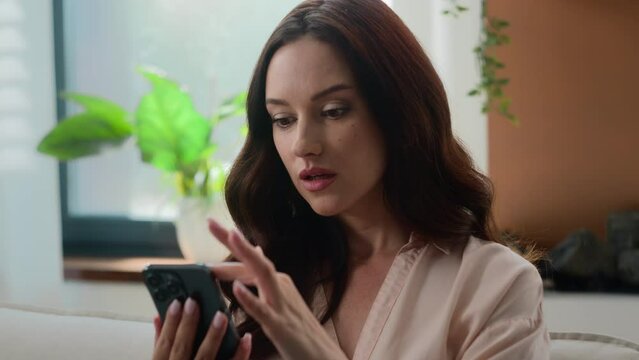 Caucasian woman serious girl female user businesswoman using mobile phone chatting with smartphone receive bad news bank reject deny massage disappointed with cellphone upset sad failure home office