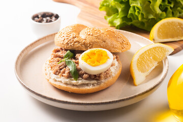 Delicious tuna open sandwiches. Buns with canned tuna, lemon, cream cheese and boiled egg.