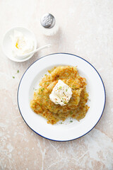 Homemade potato latkes with cream cheese