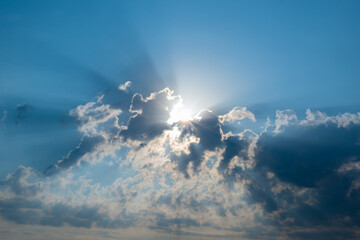 Sun rays bursting through clouds. Beautiful beam of light and the clouds. The divine sky.