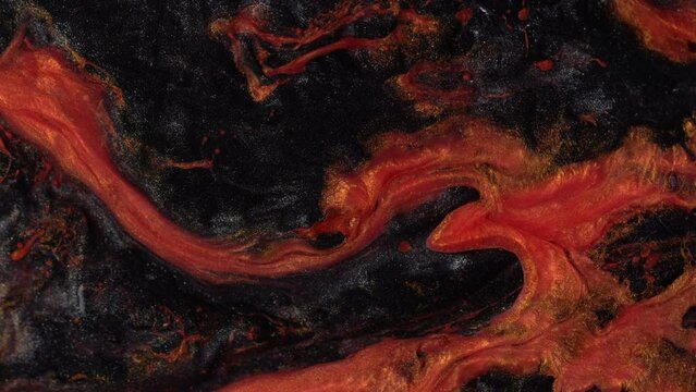 Fluid art. Abstract background with effect dramatic eruption volcano. Landscape with red-hot magma. Liquid artistic texture motion with orange and black colors.