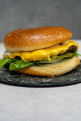 Burger with meat cutlet, hamburger isolated on grey background. Tasty Hamburger. Restaurant dish. 