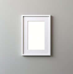 A pristine white rectangle frame hangs on the wall, creating a stark contrast to the warm indoor atmosphere and adding an elegant touch of art to the room