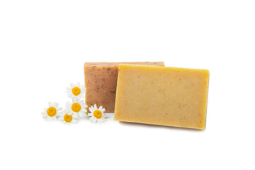 Natural homemade soap with chamomile flowers isolated on a white background. Close-up of moisturizing soap with natural herbal oils. Spa and beauty concept.