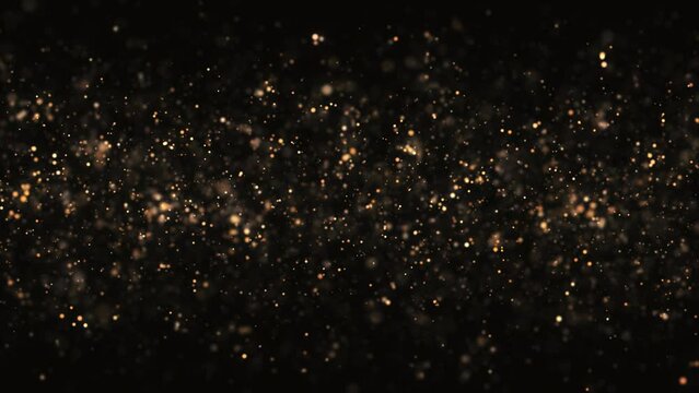 4k Gold Particles Lights. Motion Background. Golden glitter particle. Isolated on black. Defocused bokeh. Animated Overlay. 2160p. 60 fps