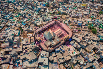 Aerial view of people celebrating the holy colour festival near the Shri And Baba Temple, Uttar Pradesh, India.