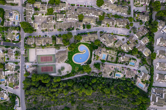 Aerial view of a lively townscape with diverse architecture and flourishing residential area, Zona Encinas, Cumbre del Sol, Alicante, Spain.