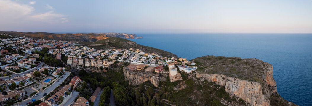 Panoramic view of a lively townscape with diverse architecture and flourishing residential area in el cime del Sol, Zona Encinas, Cumbre del Sol, Alicante, Spain.