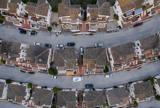 Aerial view of holiday villas disposed along a circle shape, Zona Encinas, Cumbre del Sol, Alicante, Spain.
