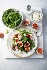 Arugula salad with figs and mozzarella cheese