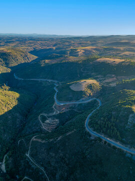 Aerial view of a mountain road crossing the Rio Macas in Braganza, Portugal.