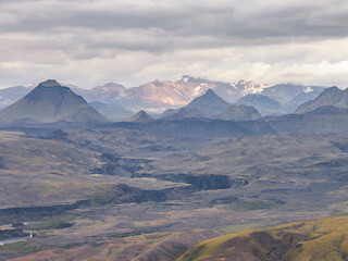 Aerial view of highlands mountain landscape with a canyon crossing the valley in Hvolsvollur, Southern Region, Iceland.