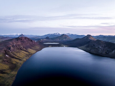 Aerial view of Alftavatn Lake at twilight among the mountains in the highlands of Iceland, Hella, Southern Region, Iceland.