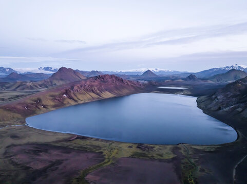Aerial view of Alftavatn Lake at twilight among the mountains in the highlands of Iceland, Hella, Southern Region, Iceland.