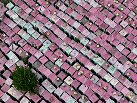 Aerial view of a phone box graveyard, a storage and dismantling facility for old phone boxes in Brandenburg, Germany.