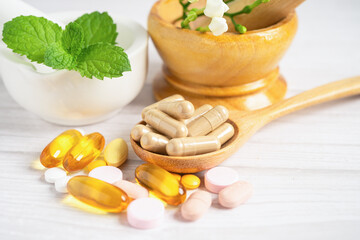 Alternative medicine herbal organic capsule with vitamin E omega 3 fish oil, mineral, drug with herbs leaf natural supplements for healthy good life.