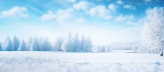 A snowy landscape with trees and a blue sky with fluffy white clouds. The ground is covered in a thick layer of snow. Peaceful and serene mood. Winter background with plenty of copy space.