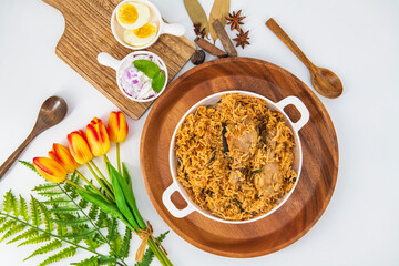 Chicken Biryani made with basmati rice and spices served in plate combined with chicken tandoori. Biryani Indian Asian rice meal. Chicken Dum Biryani made with basmati rice and spices 
