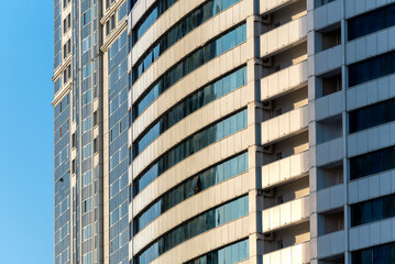 Fototapeta premium many windows and walls facade of a modern skyscraper without people