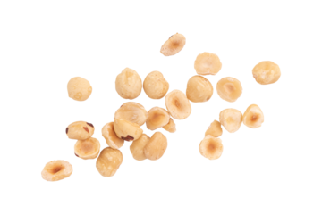heap of roasted peeled hazelnuts isolated on white background with clipping path, top view, concept of healthy breakfast, vegan food