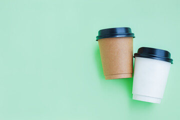White and Brown paper coffee cup on green background, Takeaway coffee cup