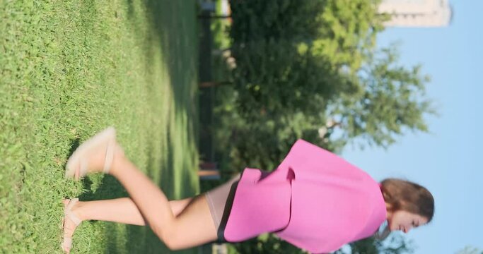 Funny yoga coach female puts thin yoga mat over her shoulders and walk. Concept of misusing things