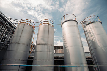 Stainless vertical chemical row tanks with pressure meter in equipment tank chemical cellar at with stainless steel