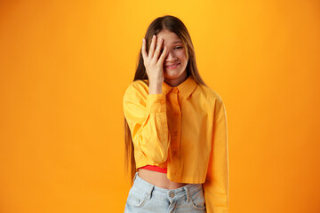 Upset disturbed teen girl on yellow background