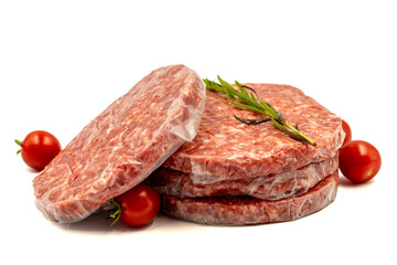 Raw hamburger patty isolated on white background. Raw veal hamburger patties with herbs and spices. Close up