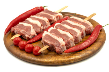 Raw lamb tenderloin isolated on white background. Raw lamb tenderloin with herbs and spices. Close up