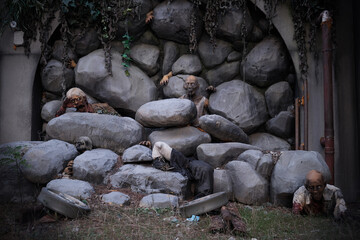 Zombie figure on the rocks for Halloween decoration