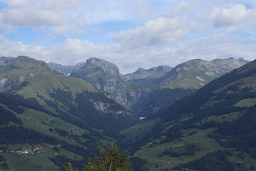 Obraz premium A picture taken from high up on the mountains, showing the beautiful swiss alps from afar, taken in obersaxen, switserland.