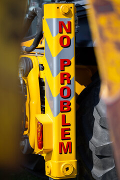 No problem writing text in red capital letters font with yellow background building machinery heavy duty.