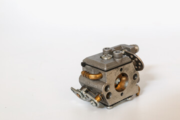 Chainsaw carburetor old on a white background..For chainsaw carburetor  spare part.