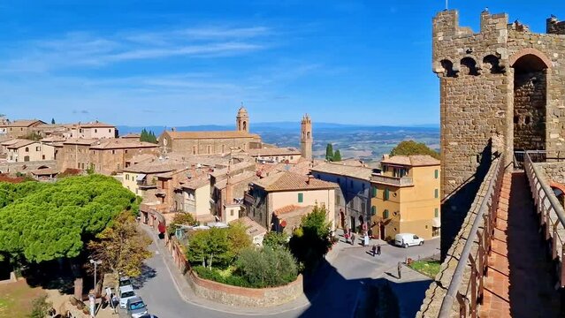 Montalcino - scenic medieval town in Tuscany. 4k video  from fortified wall of the castle. Italy travel and historic traditional towns