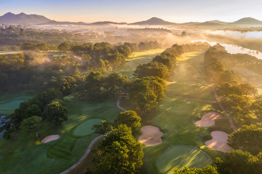 Top view aerial photo from flying drone of a Da Lat City with development buildings and fog,nature beautifull, famoust travel city of Vietnam. Doi Cu area