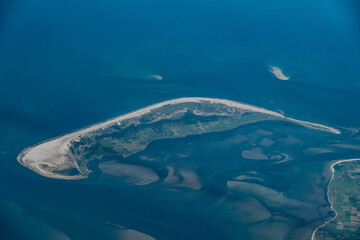 Aerial landscape view of Amrum Island, part of North Frisian Islands in Nordfriesland district with settlements on east coast and the largest village Nebel.   - obrazy, fototapety, plakaty