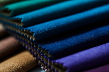Colorful samples of upholstery fabrics close-up. Leather and suede for furniture renovation - obrazy, fototapety, plakaty
