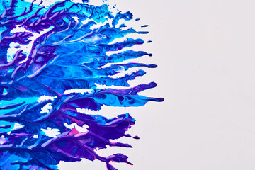 Acrylic multicolor paint blot, chaotic brushstroke, spot flowing on white paper background. Creative blue color backdrop, fluid art.