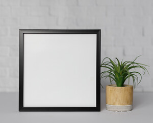 Minimal wooden picture poster frame mockup on white wallpaper