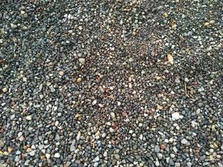 Top angle view of Pebbles with Sand as o texture background