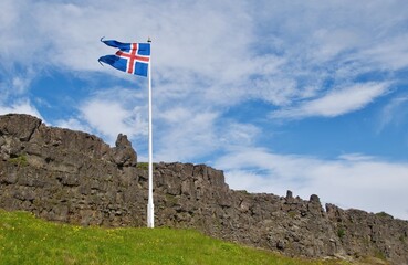 Icelandic flag flying in Thingvellir National Park in Iceland