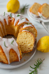 Lemon bundt cake drizzled with powdered sugar glaze