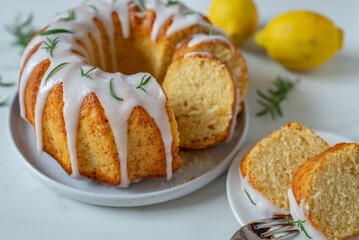 Lemon bundt cake drizzled with powdered sugar glaze