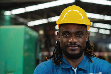 Close-up. African American worker in factory, maintenance work in modern industrial concept. workers working in factory Professional engineer.