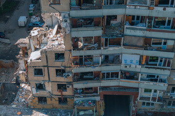 A Russian rocket flew into a residential building in the city of Dnipro, Ukraine. A residential building destroyed by an explosion after a Russian missile attack from above. Scars of war.