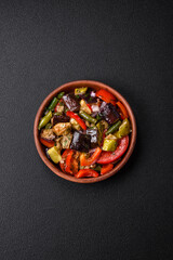 Delicious fresh salad of grilled vegetables peppers, tomatoes, eggplants and zucchini