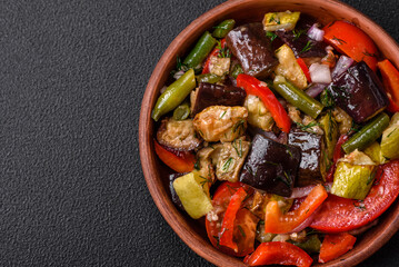 Delicious fresh salad of grilled vegetables peppers, tomatoes, eggplants and zucchini